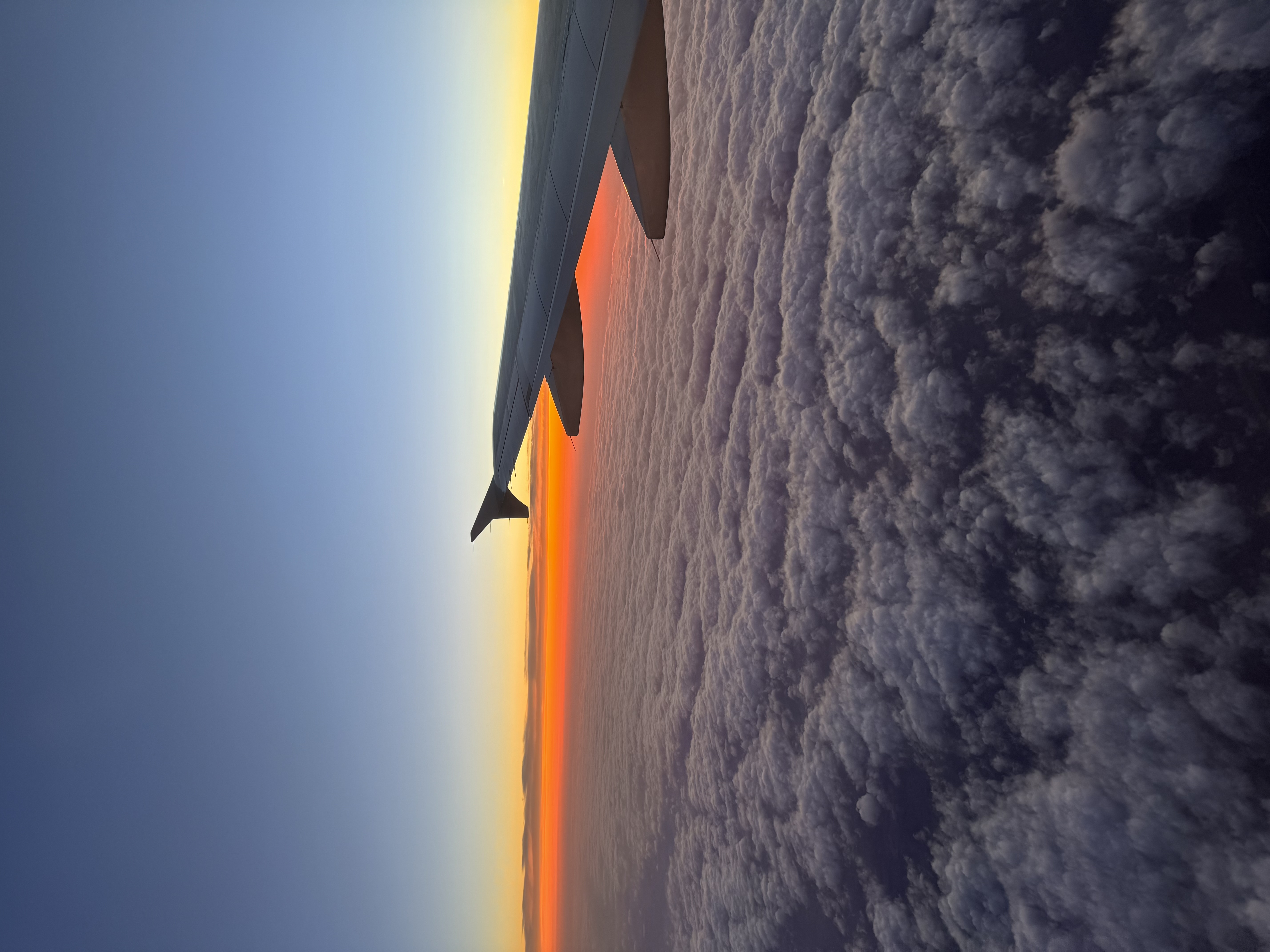Above the clouds at sunset